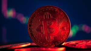 Coins with bitcoin symbol on red light and crypto stocks chart b
