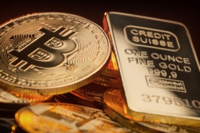 Bitcoin,And,Gold,Ingot,Lying,On,A,Pile,,Store,Of