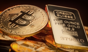 Bitcoin,And,Gold,Ingot,Lying,On,A,Pile,,Store,Of