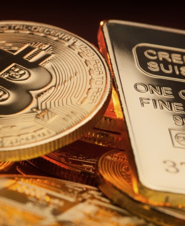 Bitcoin,And,Gold,Ingot,Lying,On,A,Pile,,Store,Of